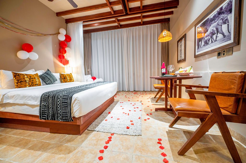 Romantically decorated single room with rose petals and balloon décor at Entikko Safari Lodge Uganda near Murchison Falls