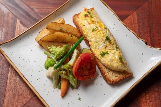 image showing food with rolex a local food popular in africa that is mixed with eggs and fries