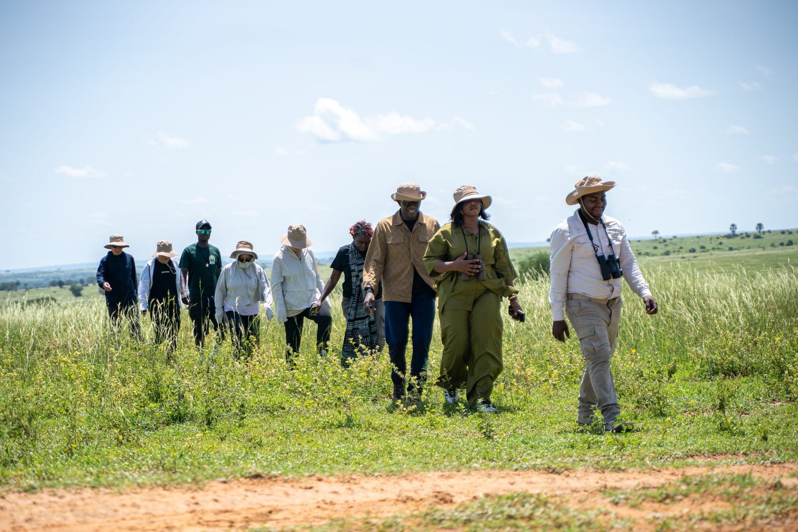 Guests on a guided nature walk at Entikko Safari Lodge exploring the wildlife and flora near Murchison Falls.
