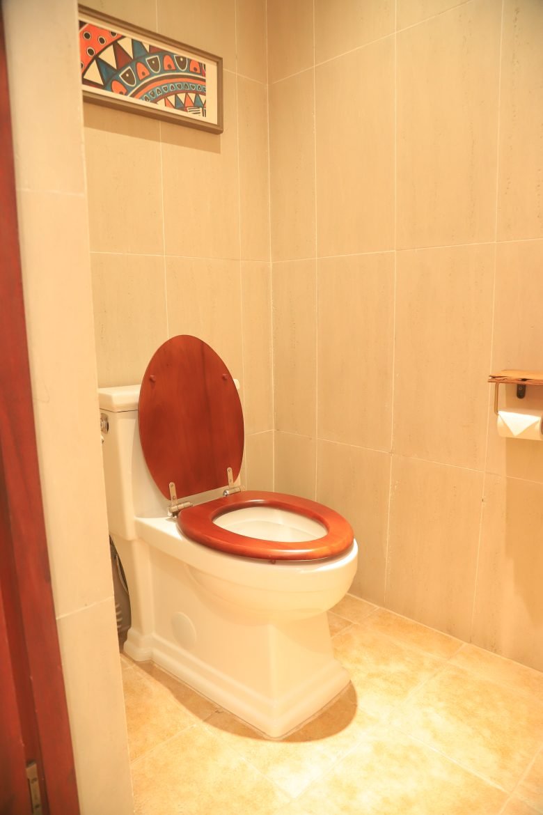 Toilet facility inside the private bathroom of a single room at Entikko Safari Lodge