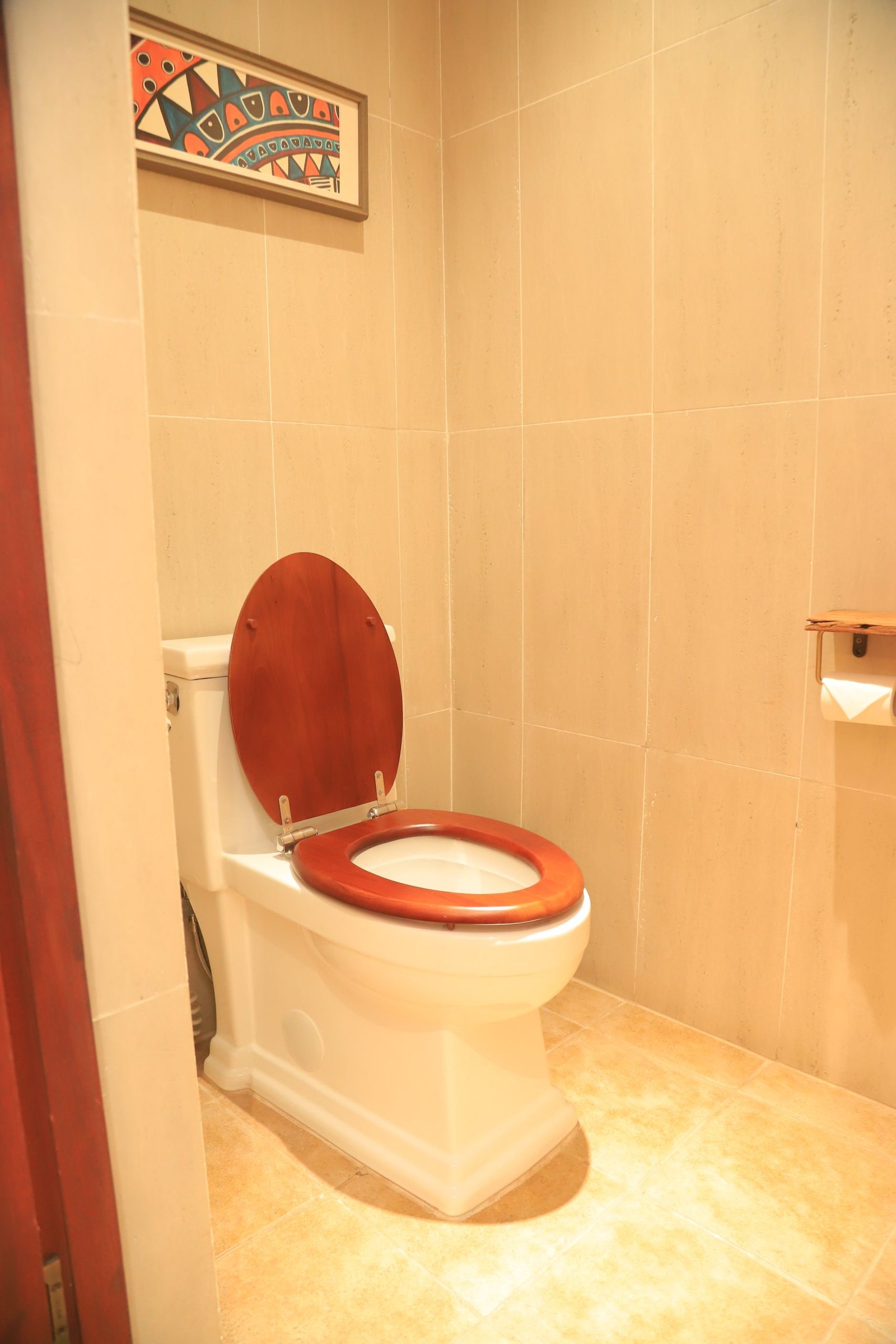 Toilet facility inside the private bathroom of a single room at Entikko Safari Lodge