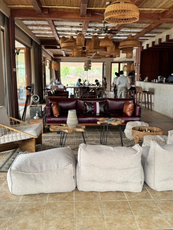 Outdoor restaurant at Entikko Safari Lounge with drinks and comfortable seating area in Murchison Falls