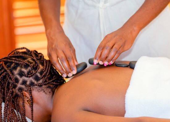 Guest receiving a relaxing massage at Entikko Safari Lodge spa in Murchison Falls National Park, Uganda