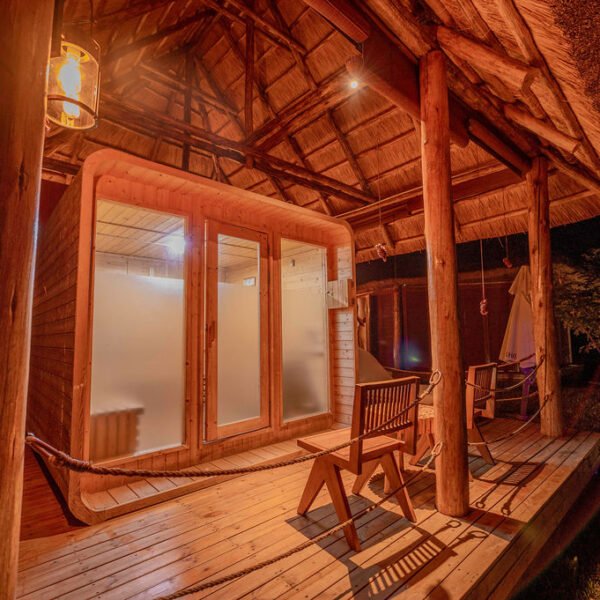 Private sauna and relaxation area with warm wooden interiors at Entikko Safari Lodge Uganda near Murchison Falls