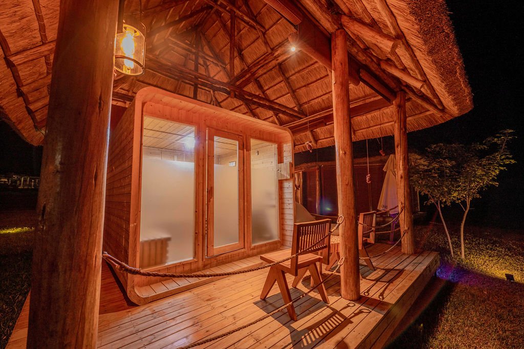 Private sauna and relaxation area with warm wooden interiors at Entikko Safari Lodge Uganda near Murchison Falls
