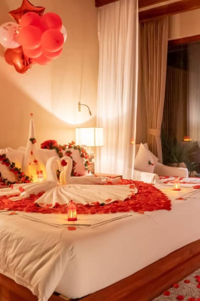 Honeymoon single room with rose petal heart design and warm night lighting at Entikko Safari Lodge Uganda